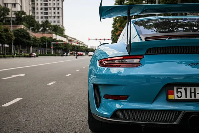 Blue Porsche 911 GT2 sports car representing high-value vehicle insurance options in Portugal